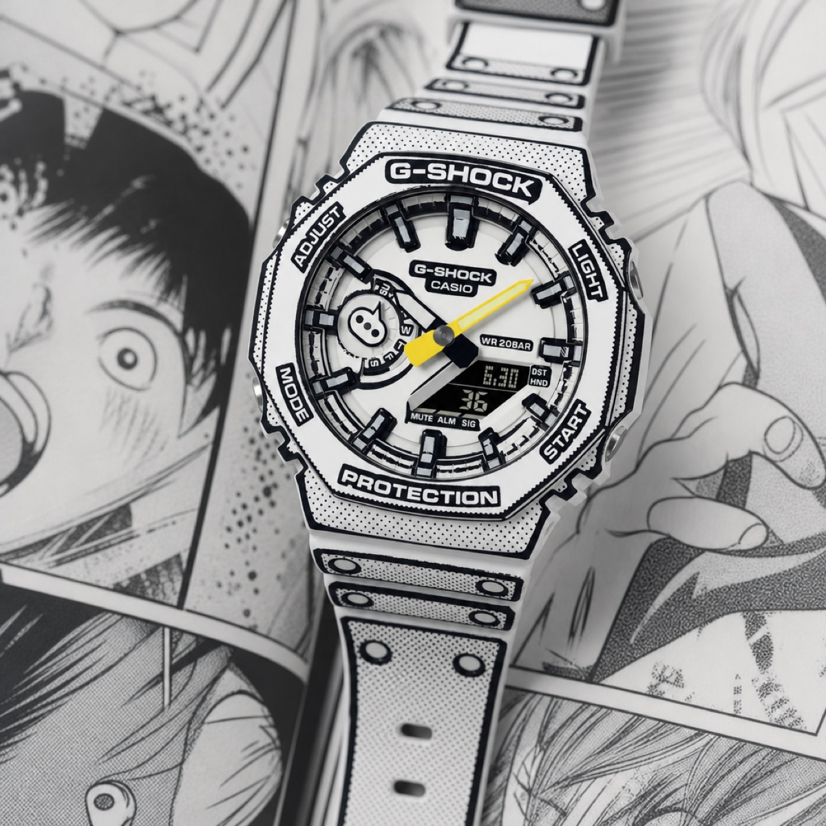 Close view of the white GA-2100MNG-7A dial, showing the screentone dots, the speech-balloon day indicator at 9 o'clock and the yellow minute hand