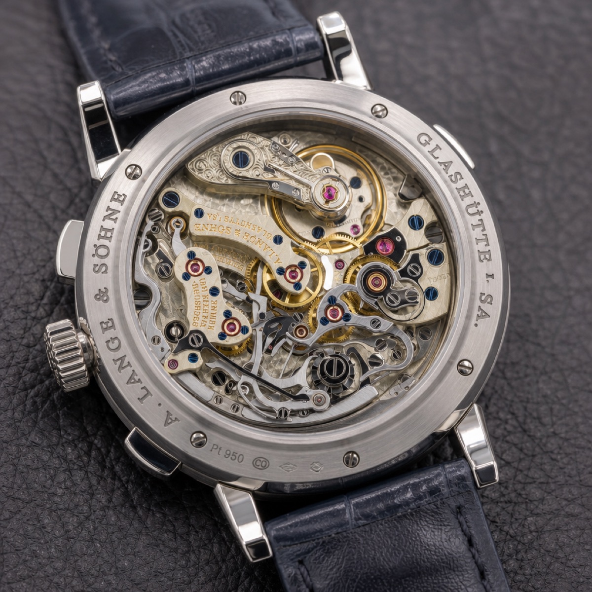 The Datograph Up/Down 405.035 turned over, showing the hand-finished L951.6 movement with its column wheel and engraved balance cock through the sapphire caseback