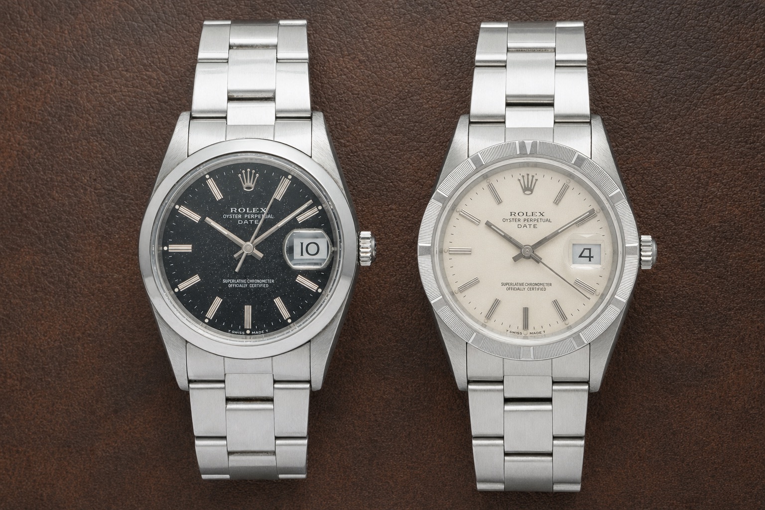 A Rolex Date 15200 with its smooth polished bezel beside a 15210 with its engine-turned bezel