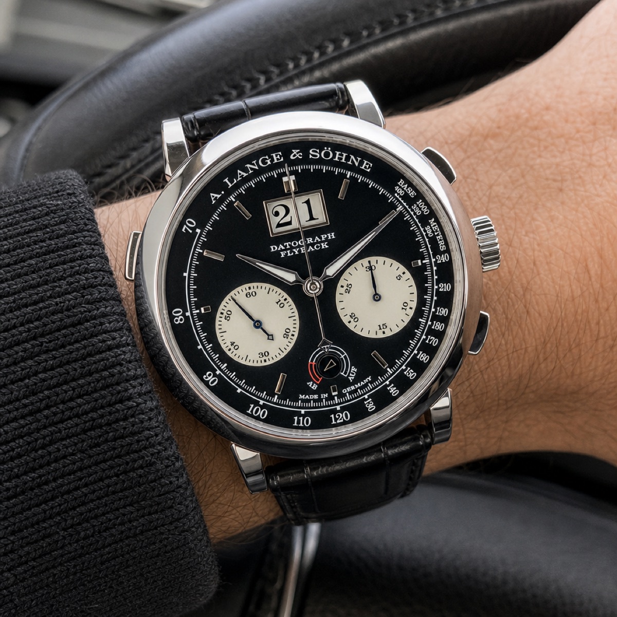 Close view of the Datograph Up/Down 405.035 dial, showing the small power-reserve scale marked Auf and Ab at 6 o'clock between the two silvered subdials